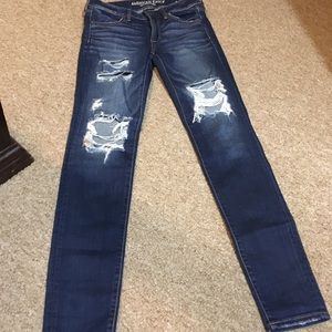 Dark blue ripped jeans
